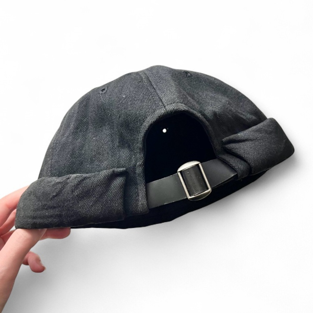 Black brimless cap